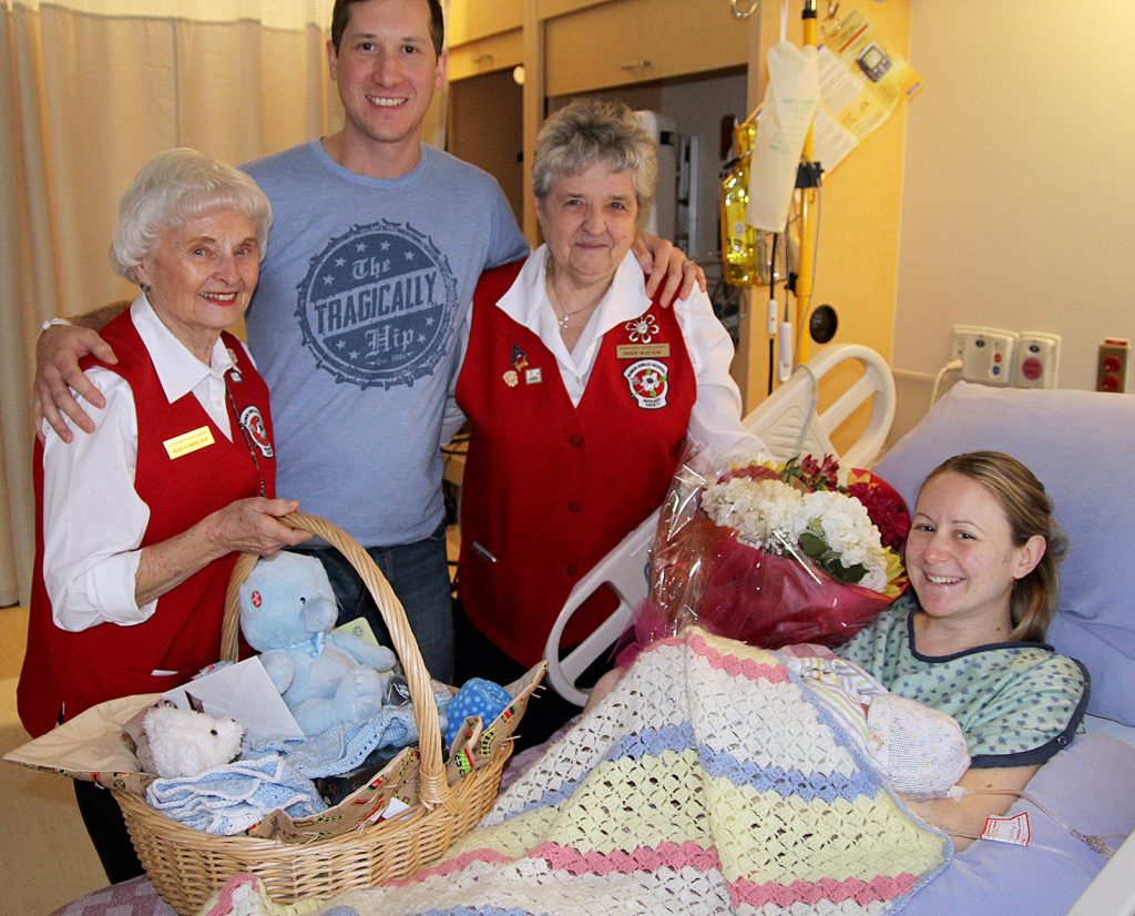 Lisa VanderVelde/Morning Star May Correale (left) and Dixie Mackie of the Vernon Jubilee Hospital Auxiliary shower Fay and Nathan Koss and their New Year’s baby boy Eliot Steven Koss with gifts.